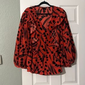 Orange and black ruffled blouse